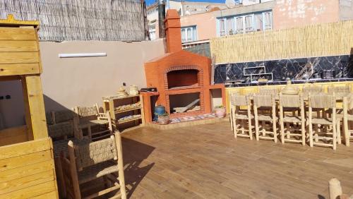 a view of a balcony with chairs on a building at Habibi Hostel in Taghazout