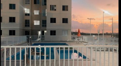 a pool on the balcony of a building at Residência da day in Aracaju