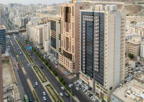 an aerial view of a city with tall buildings at Hotel 21 Makkah in Mecca