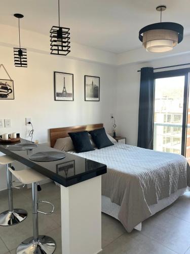 Giường trong phòng chung tại Monoambiente Alto 20 II