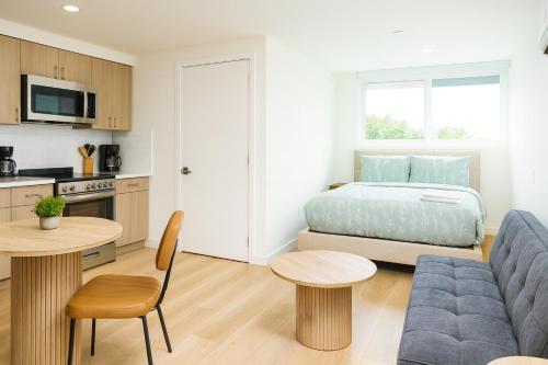 a living room with a bed and a kitchen at Los Angeles Premium City Suites - Free Secured Parking in Los Angeles