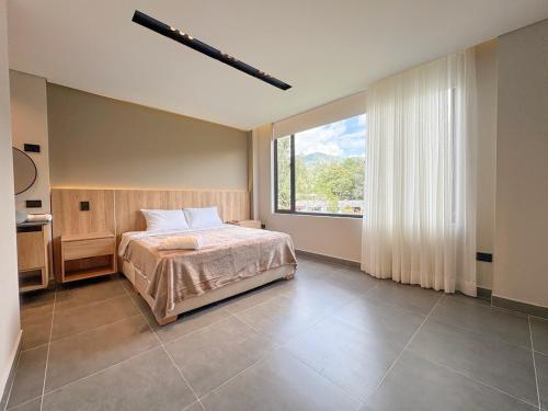 Ένα ή περισσότερα κρεβάτια σε δωμάτιο στο Apartamento de lujo a 3 minutos del Aeropuerto JMC 301
