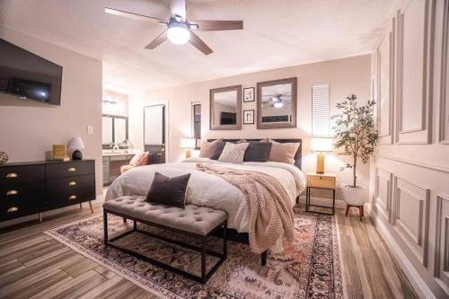 a bedroom with a bed and a ceiling fan at Cactus Luxury, Comfort, and Amenities galore! in Scottsdale