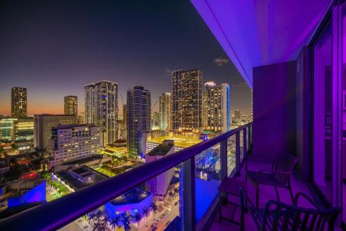 a balcony with a view of a city at night at FIFA 2026 Luxury Studio Near Brickell - Bayfront Park - Free Parking - Gym & Rooftop Pool in Miami
