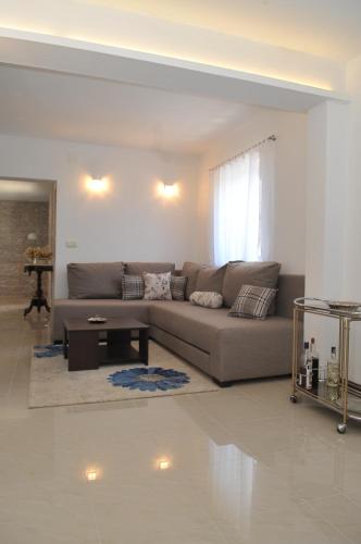 a living room with a couch and a table at Villa Sofia in Povlja