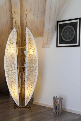 a large vase sitting on the floor next to a wall at Tsarsko Selo Spa Hotel in Sofia