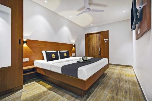 a bedroom with a large bed in a room at Townhouse OAK Hi-City in Kamakhya