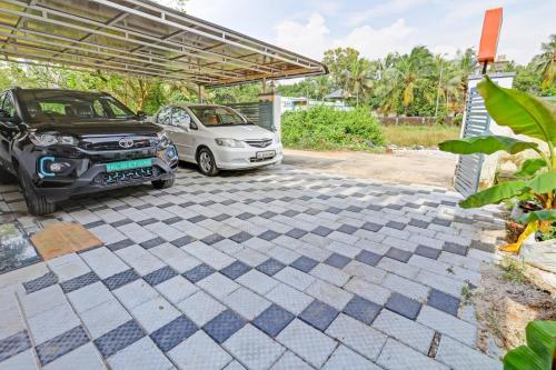 Zahrada ubytování Capital O Pop Tavern Kazhakkottam