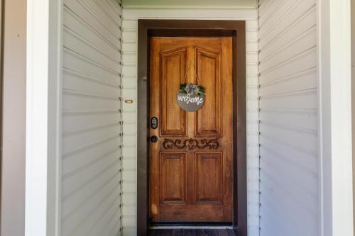 a wooden door on a house with a wreath on it at Hyde Park Haven - your home away from home - minutes north of Logan and USU in Hyde Park