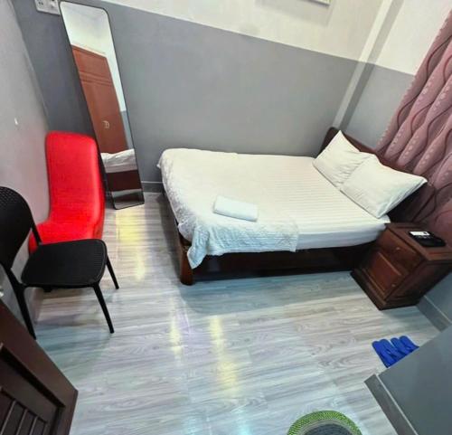 Кровать или кровати в номере Nhà Nghỉ Minh Châu Biên Hòa