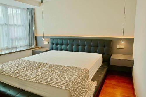 Ένα ή περισσότερα κρεβάτια σε δωμάτιο στο Urban Hub - Chong Qing Branch nice river view luxury large flat 5br