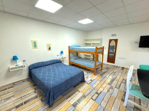 Ένα ή περισσότερα κρεβάτια σε δωμάτιο στο Alojamientos Meca