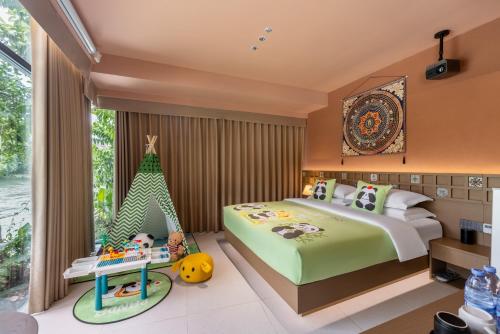 a bedroom with a bed and a toy tent at Yinshi Yunshe Private Hot Spring Villa in Dujiangyan in Dujiangyan