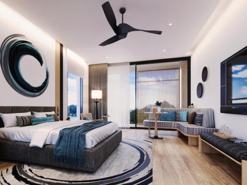a bedroom with a bed and a couch at MontAzure Resort Phuket - MGallery Collection in Phuket Town