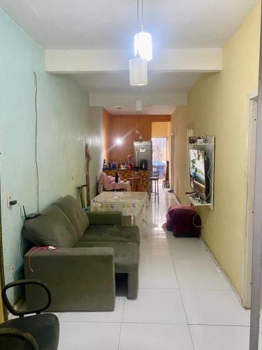 a living room with a couch and a table at CASA Cop 30 in Belém