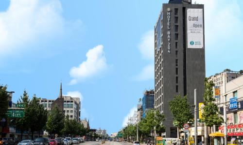 a tall building in the middle of a city at Dobong Hotel Bay204 in Seoul