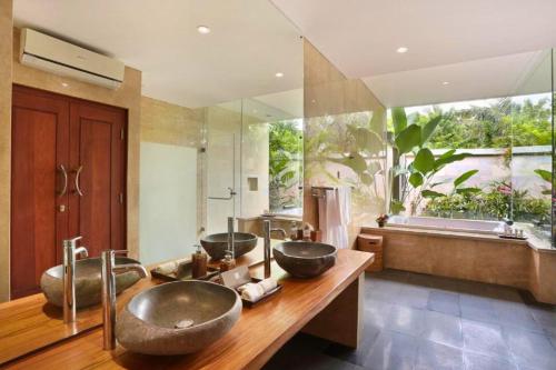 a bathroom with two sinks and a large window at Aitana 3 BR Private Pool Villa ZN286 in Blahbatu