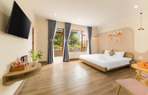 Ένα ή περισσότερα κρεβάτια σε δωμάτιο στο TT House Pleiku