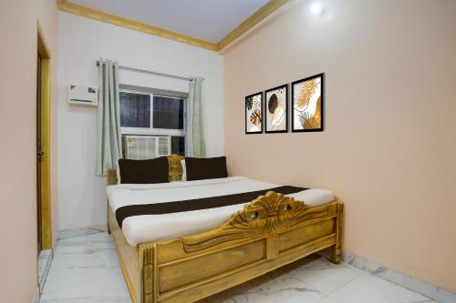 Ένα ή περισσότερα κρεβάτια σε δωμάτιο στο Super Hotel O Patliputra Golambar