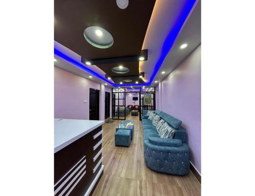 a living room with blue lights on the ceiling at HotelSonamTawang in Tawang