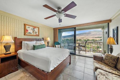 a bedroom with a bed and a ceiling fan at Lahaina Shores 512 · LS 512 Getaway Studio by the Beach Pool Hot in Lahaina