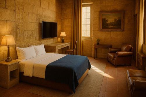 a bedroom with a bed and a chair and a television at Wellohous GVB in Red Deer