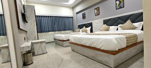 Ένα ή περισσότερα κρεβάτια σε δωμάτιο στο HOTELSunlight inn