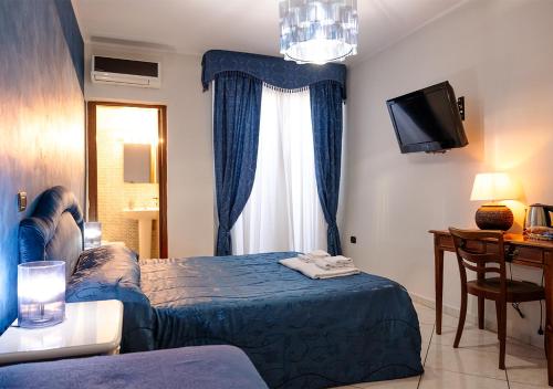 Ένα ή περισσότερα κρεβάτια σε δωμάτιο στο Spartacus