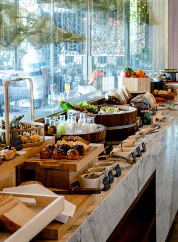 a buffet line with many different types of food at V Villas Phuket - MGallery Collection in Panwa Beach