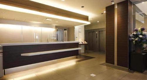 a lobby with a reception desk in a building at Nagoya Fushimi Montblanc Hotel in Nagoya