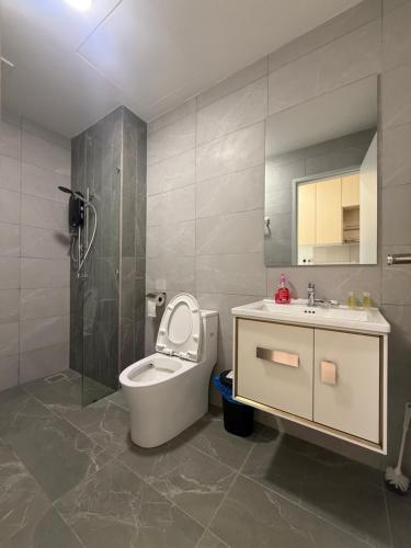 a bathroom with a toilet and a sink at Majestic Residence Klcc by Like Home in Kuala Lumpur