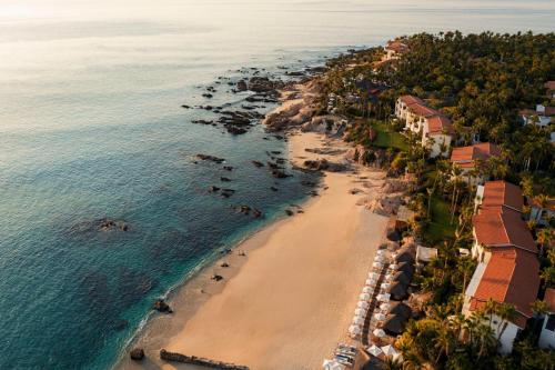 an aerial view of a beach with houses and the ocean at One&Only Palmilla in San José del Cabo