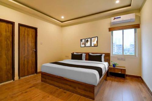Postel nebo postele na pokoji v ubytování Hotel O Chinar Park Formerly Zapper Inn