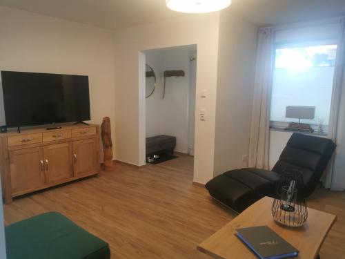 TV a/nebo společenská místnost v ubytování Hafenkoje Arthur