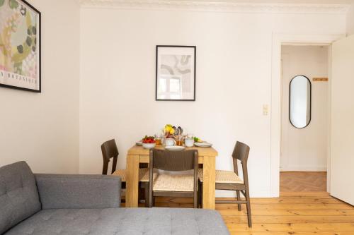 a dining room with a table and chairs at Homely 5 Person Apartment in Amager in Copenhagen