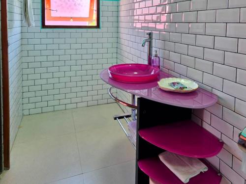 a pink bathroom with a sink and a counter at Bali Dream Beach House - Family Friendly Villa in the Heart of Sanur Beach, Cafes, Market & Shopping in Sanur