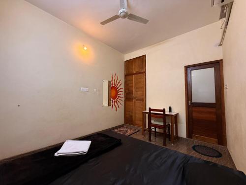 Postel nebo postele na pokoji v ubytování Aroni homestays