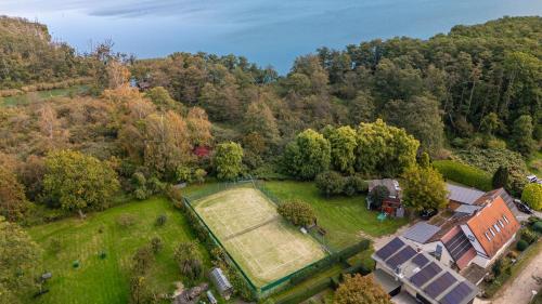 an aerial view of a house with a large lawn at Altes Tagelöhner Haus - Whg 1 in Pudagla