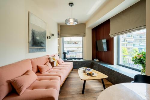 a living room with a couch and a table at City Core Katerini, Platea Lux in Katerini