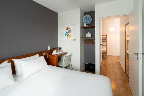 Ένα ή περισσότερα κρεβάτια σε δωμάτιο στο Sure Hotel By Best Western Guerande