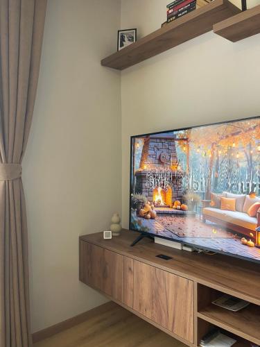 a living room with a large flat screen tv at Evergreen Lux in Kopaonik