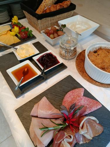 a table with many different types of food on it at Huize Triangel - Wellness studio met sauna in Noordwolde