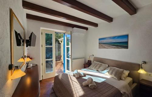 a bedroom with a bed with two towels on it at Villa Palazzo del mar Opatija by Villas Guide in Mošćenička Draga