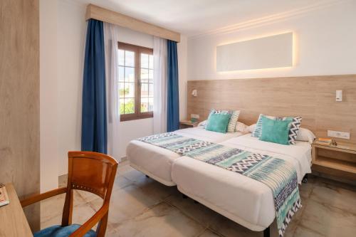 Katil atau katil-katil dalam bilik di Suite Hotel Montana Club