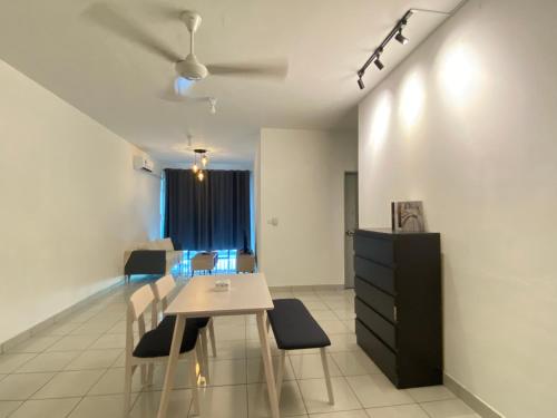 a dining room with a table and chairs at Ai Lee Haven in Papar