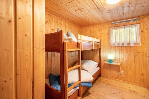 Ένα ή περισσότερα κρεβάτια σε δωμάτιο στο Bungalow 6 - Finnhütte