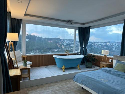 Postel nebo postele na pokoji v ubytování Homey Home Đà Lạt