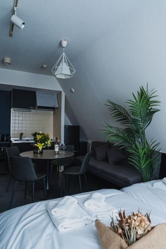a bedroom with a bed and a living room at SLL Urban Suites Akasaka in Tokyo