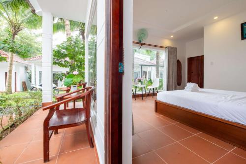 Una cama o camas en una habitación de Emma Bungalow