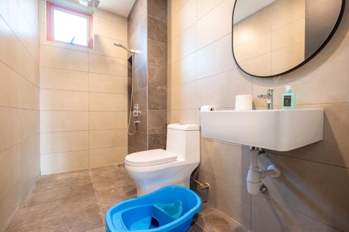 a bathroom with a toilet and a sink and a mirror at BUKIT JALIL Cute Coffee House Vibes KIDS Room in Kuala Lumpur